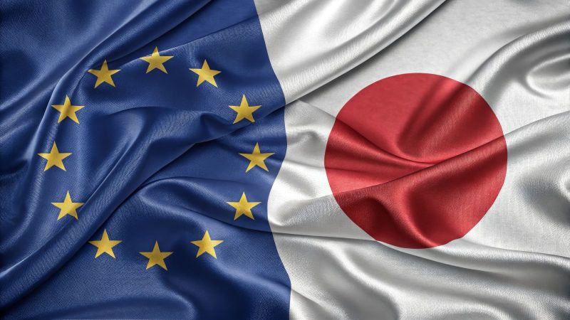 Überlappende europäische und japanische Flagge.