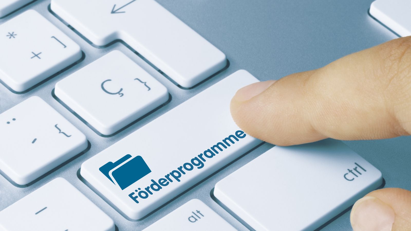 Finger auf Tastatur; Taste Förderprogramme