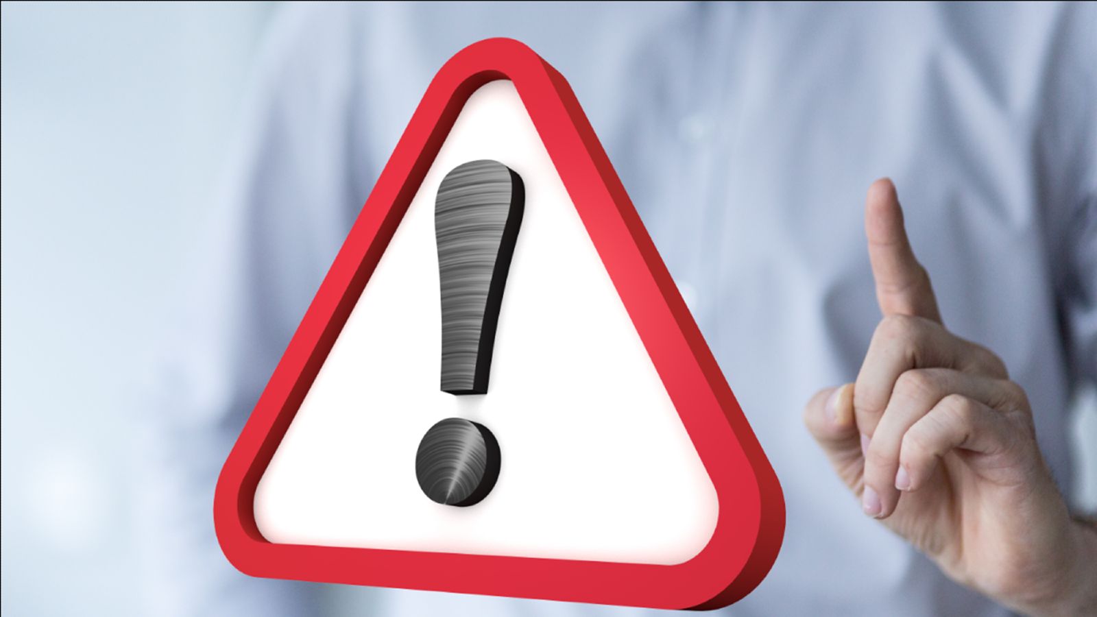 Das Bild zeigt ein Warnschild mit einem Ausrufezeichen neben einer Person die mahnend den Zeigefinger erhebt.